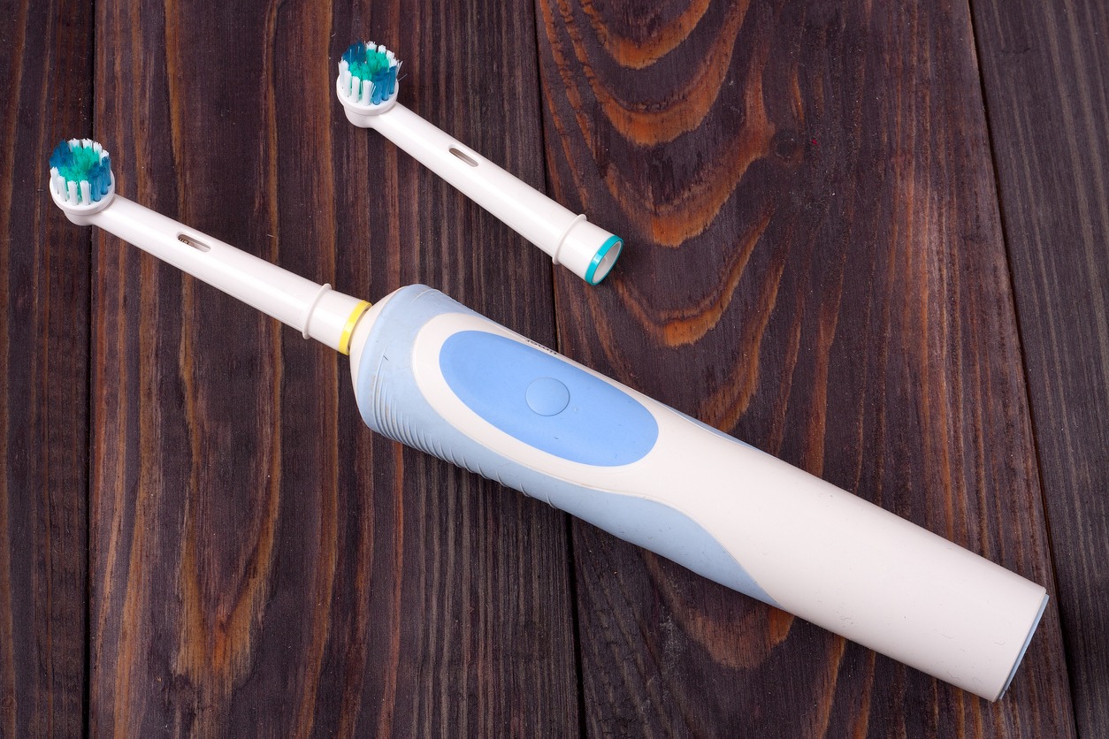 an electric toothbrush with extra brush head