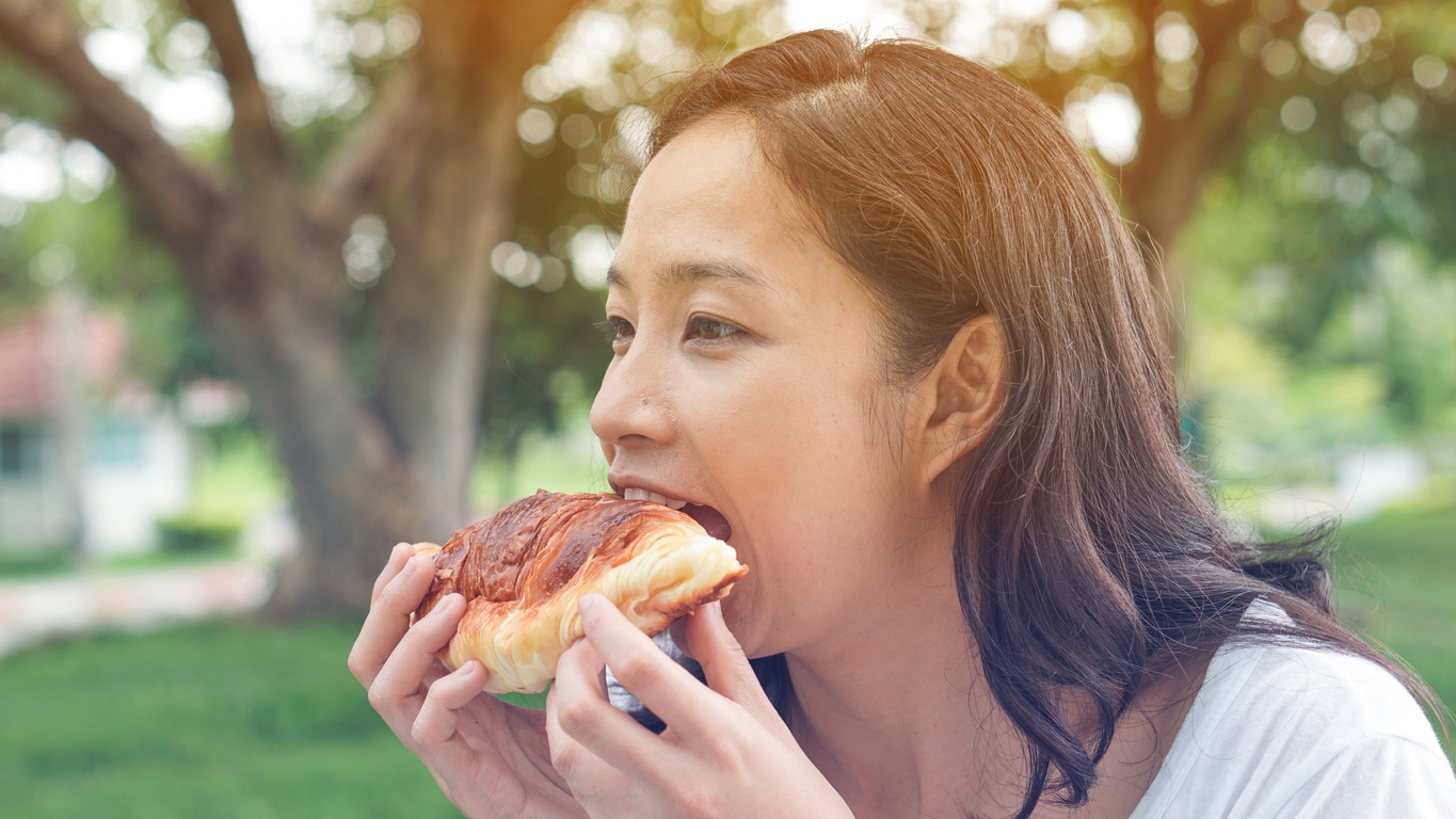 woman eating bread