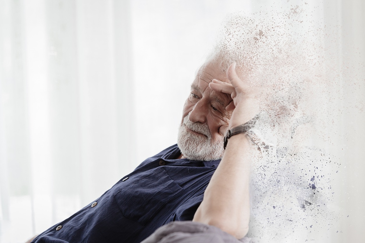 an artistic photo showing an elderly man losing his memory