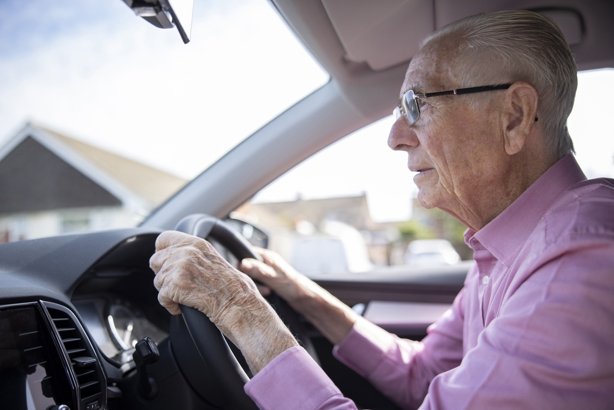 senior man driving a car