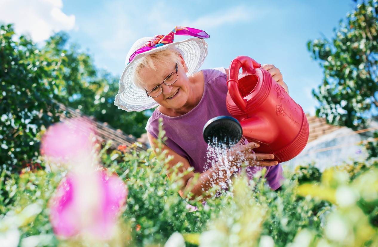 senior woman watering the plants