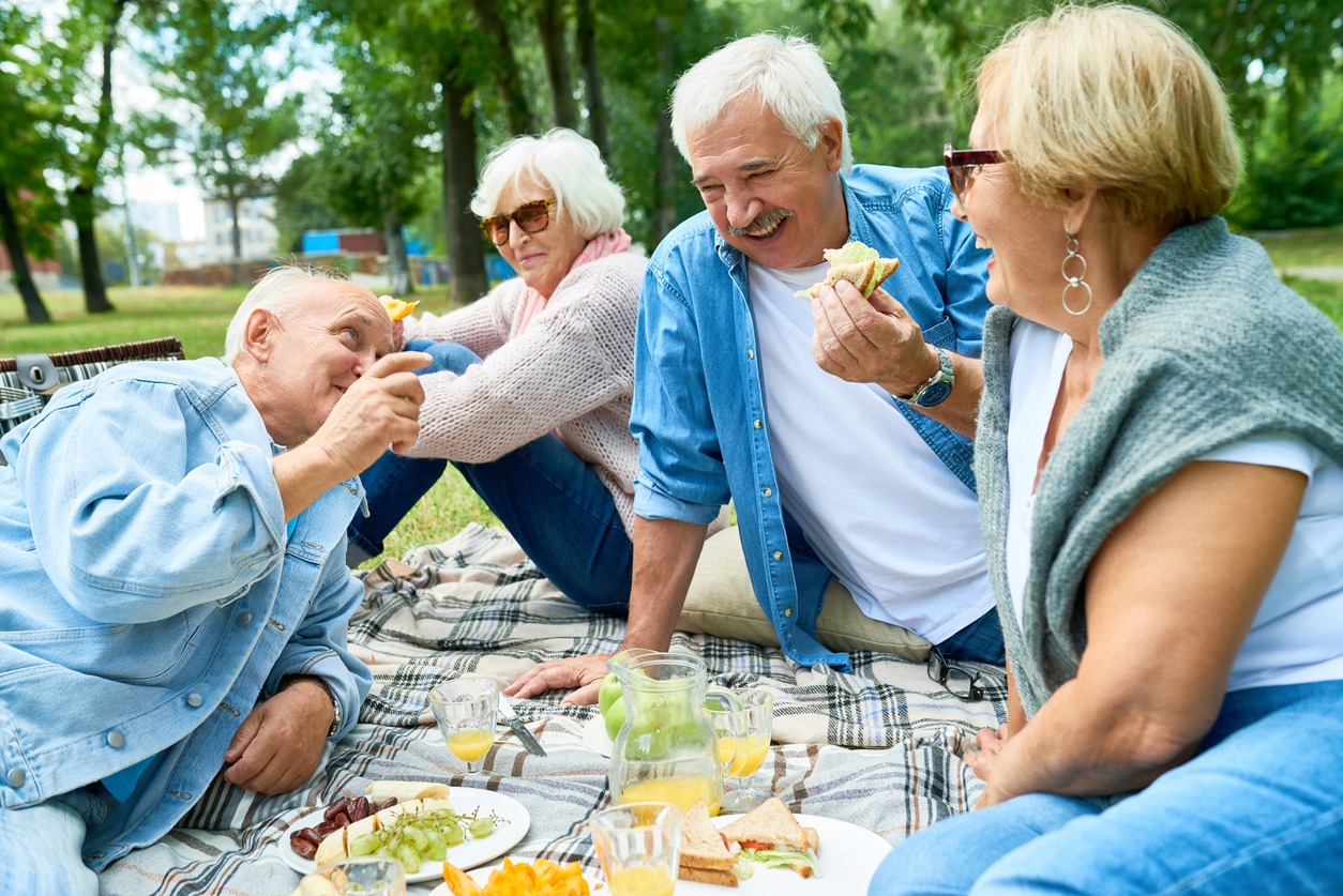 seniors enjoying a picnic outdoors