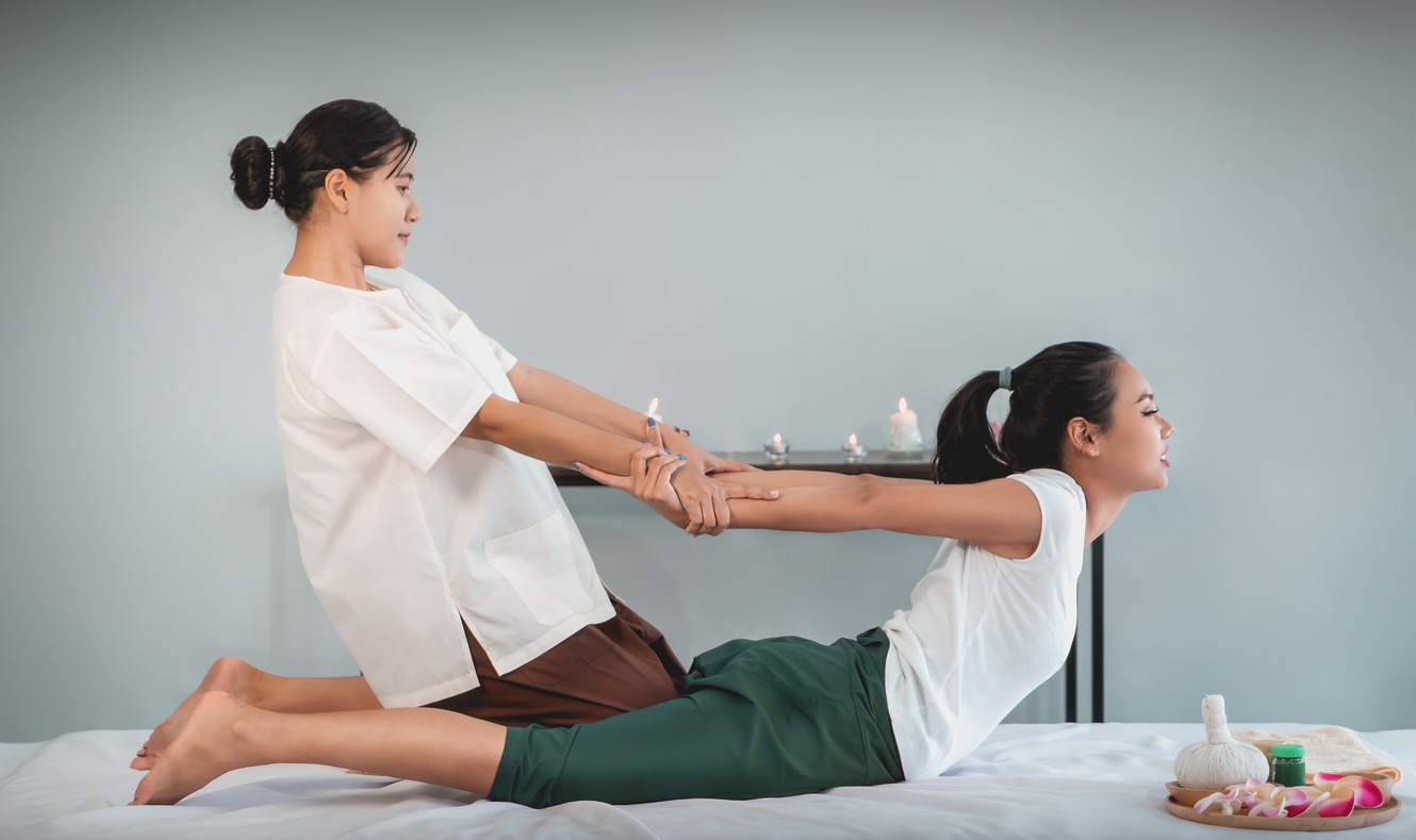 woman getting a Thai massage