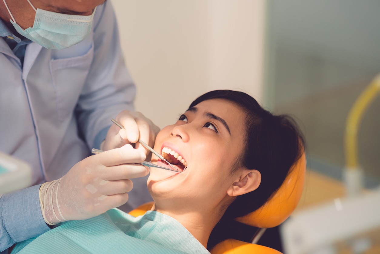 woman undergoing teeth examination in the clinic