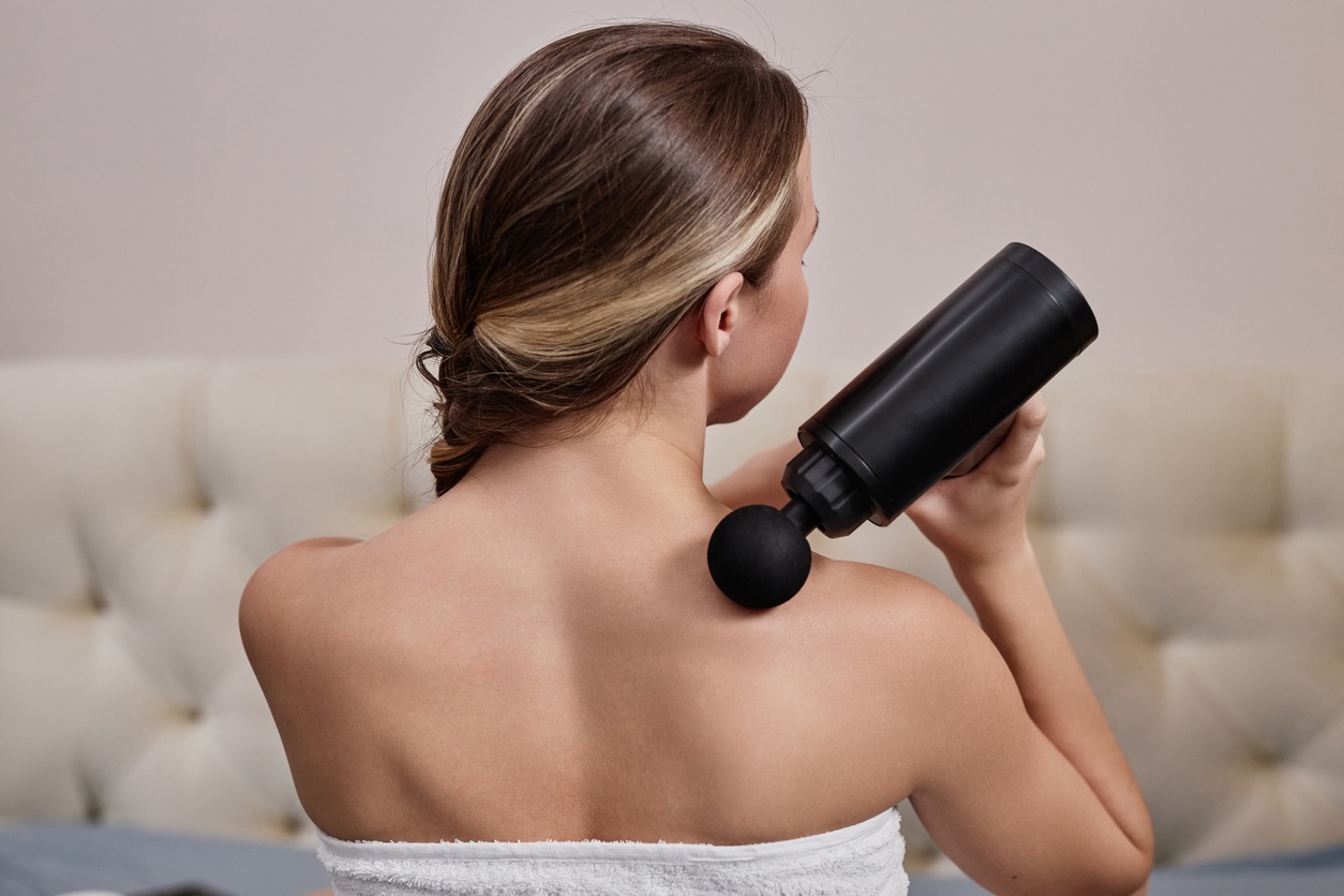 woman using a back massager