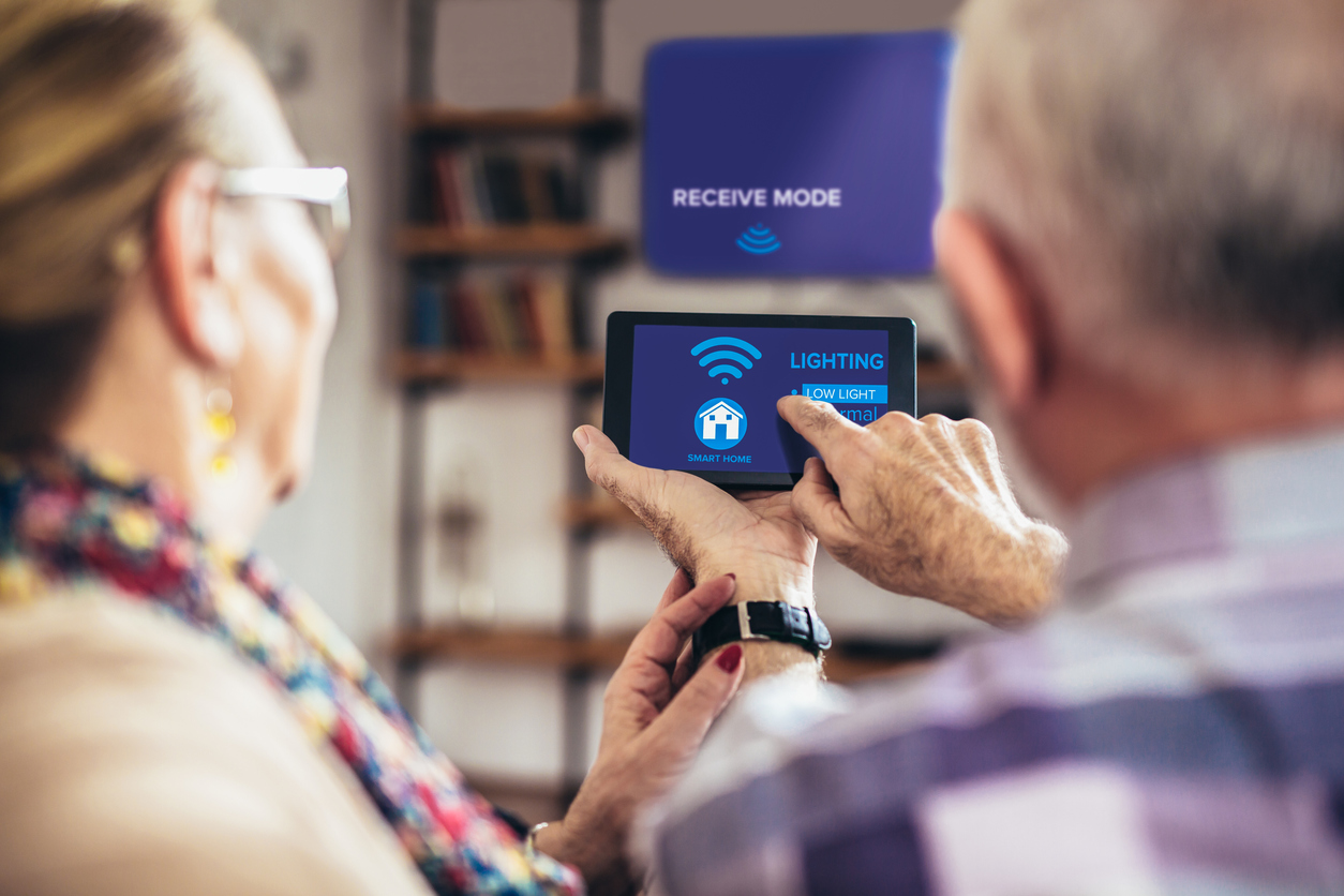 elderly couple enjoying their smart home device