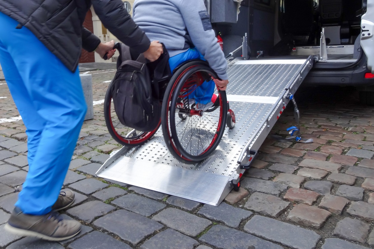 using a wheelchair ramp to go inside the car